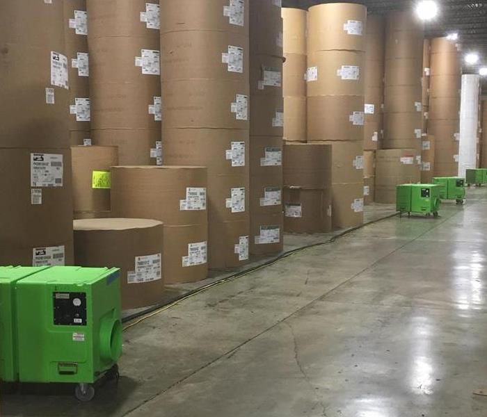 a warehouse full of boxes and drying equipment